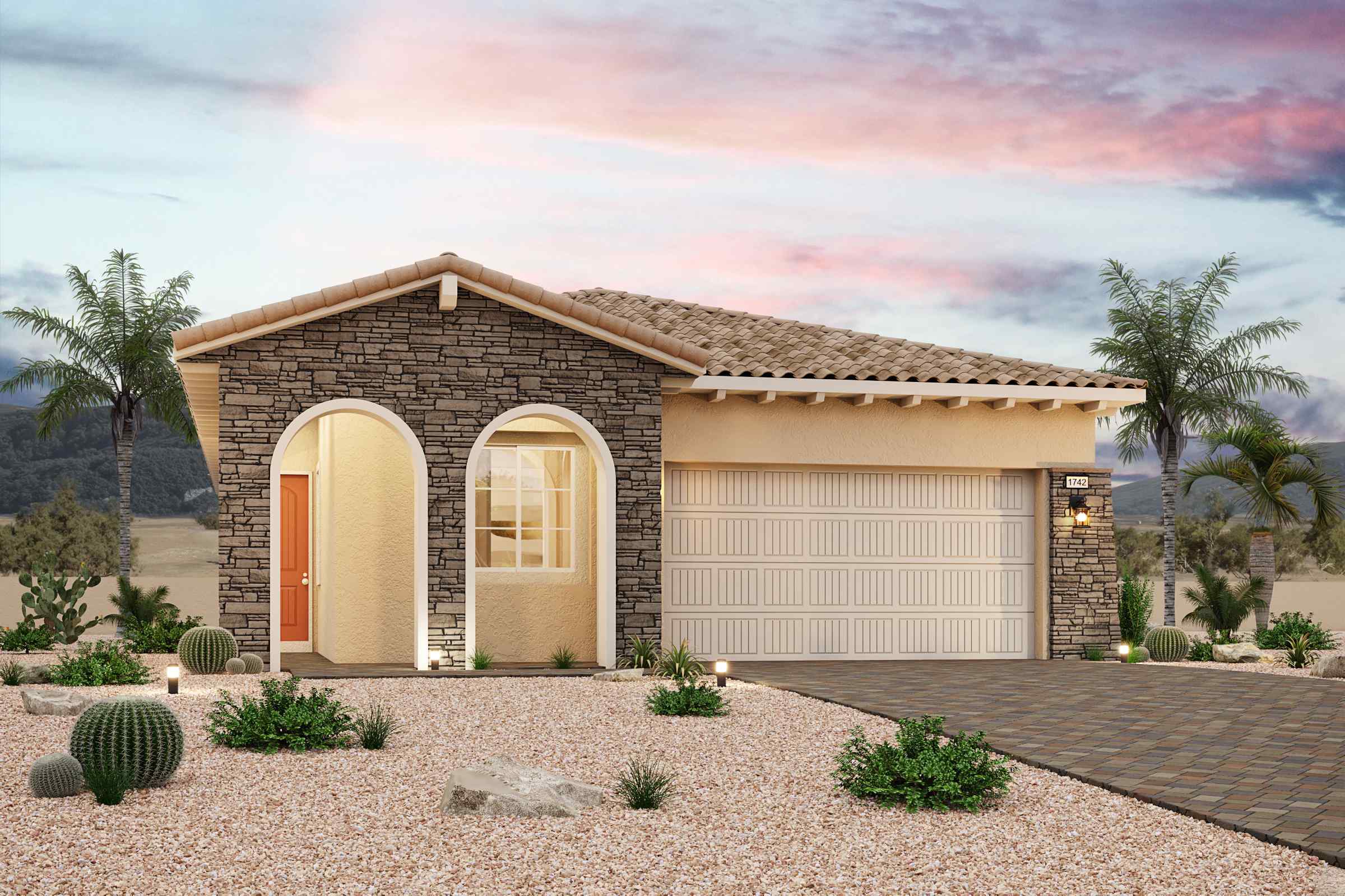 A house with a garage and palm trees.