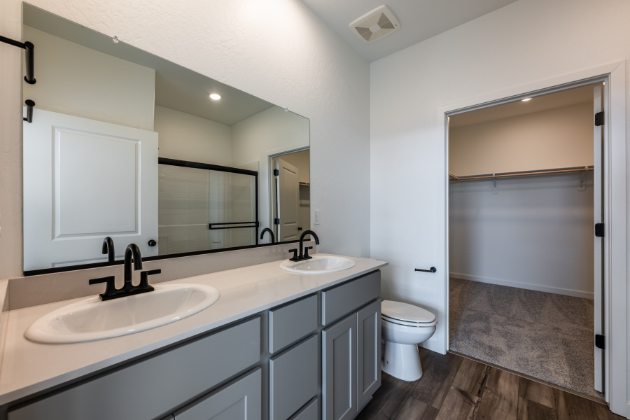 A bathroom with a sink and a toilet.