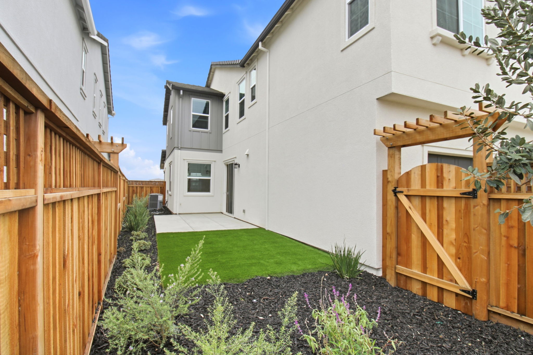 A backyard with a small garden.