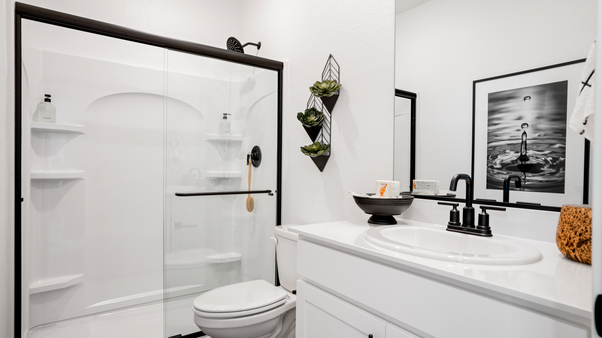 A bathroom with a glass shower.