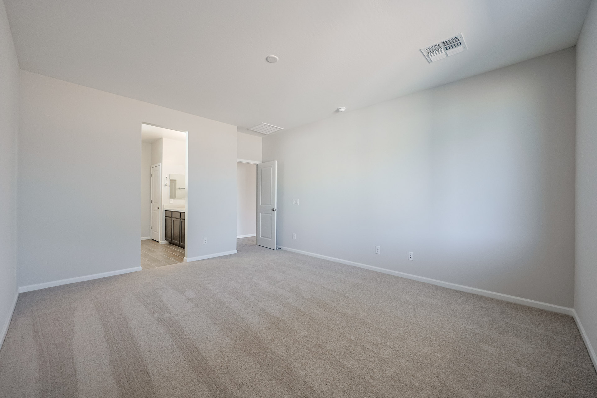A long hallway with white walls.