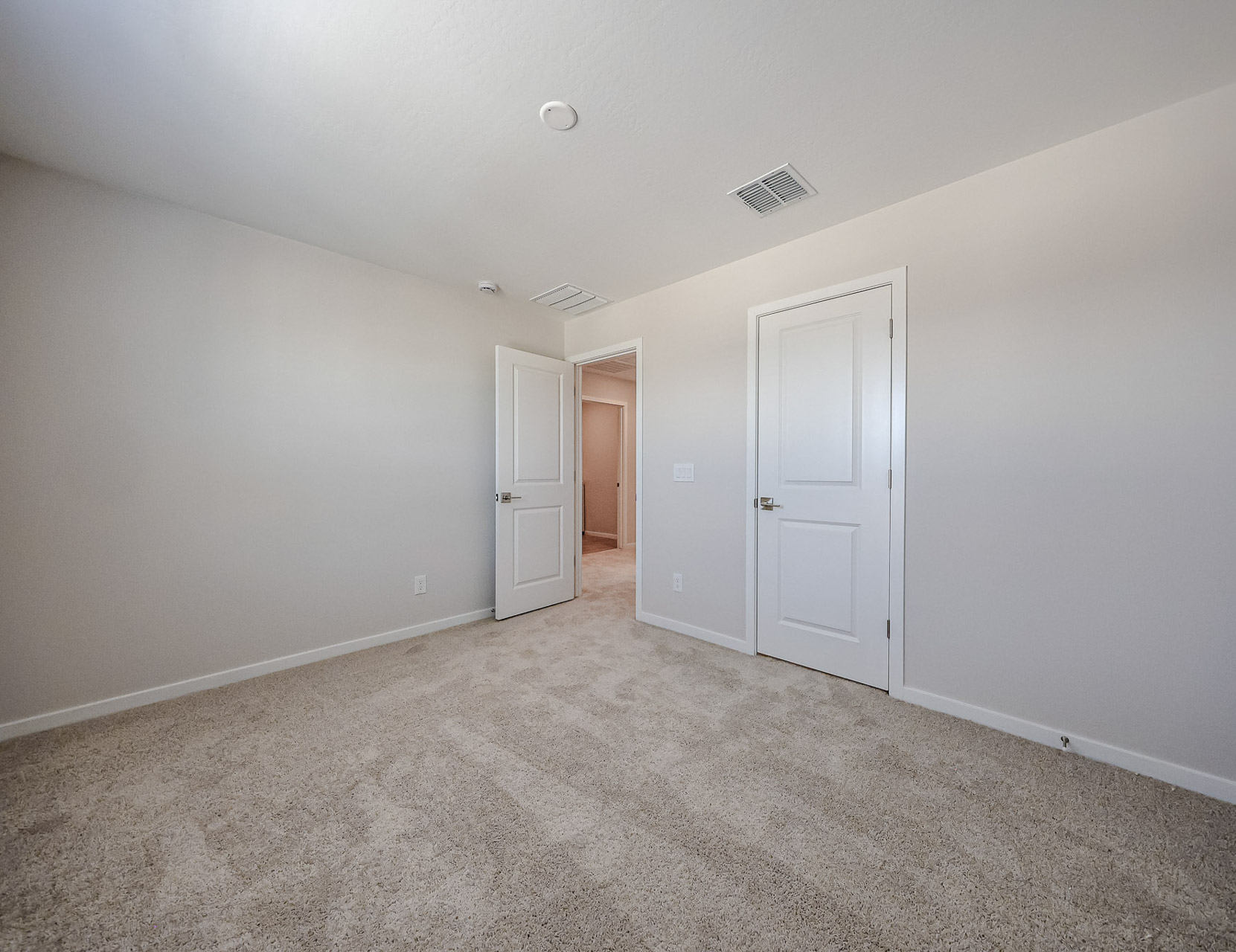 A room with white doors.