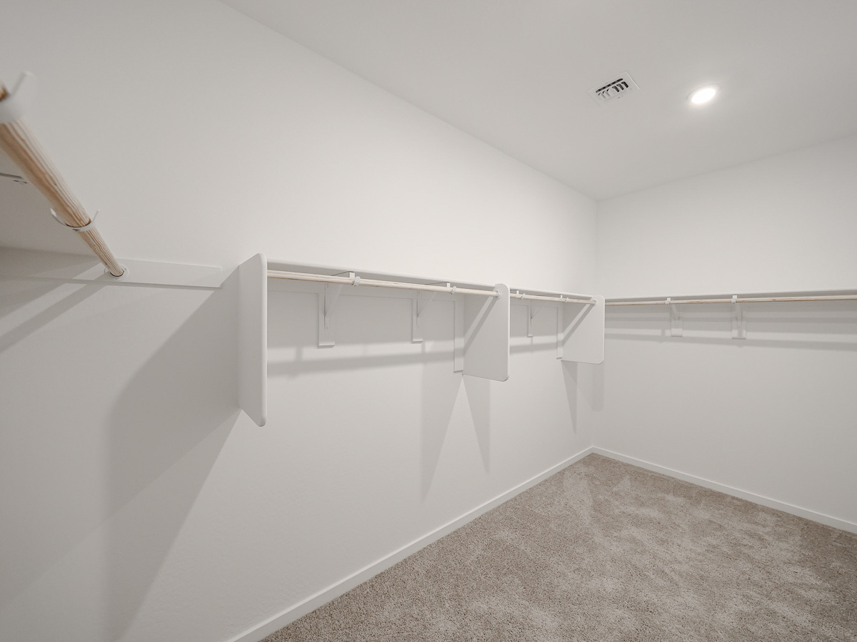 A white staircase in a room.