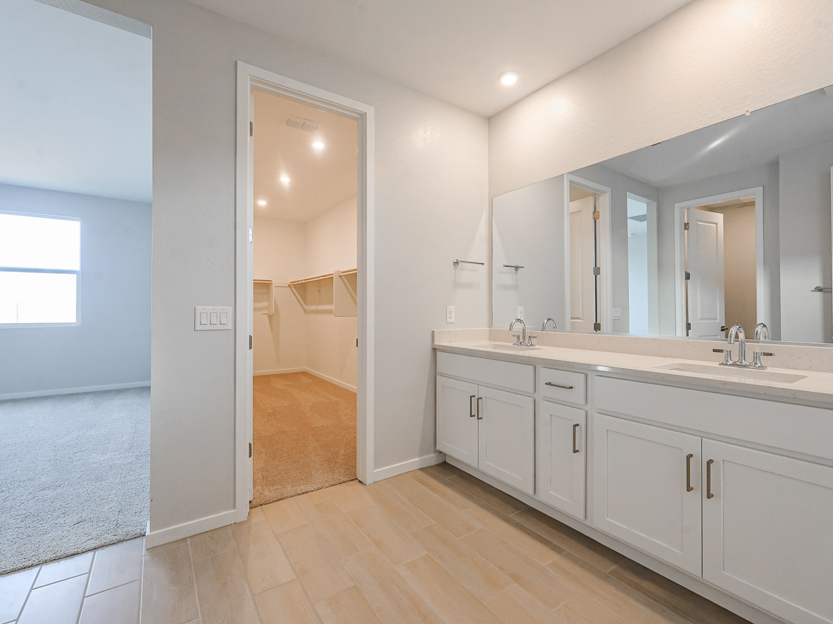 A bathroom with a large mirror.
