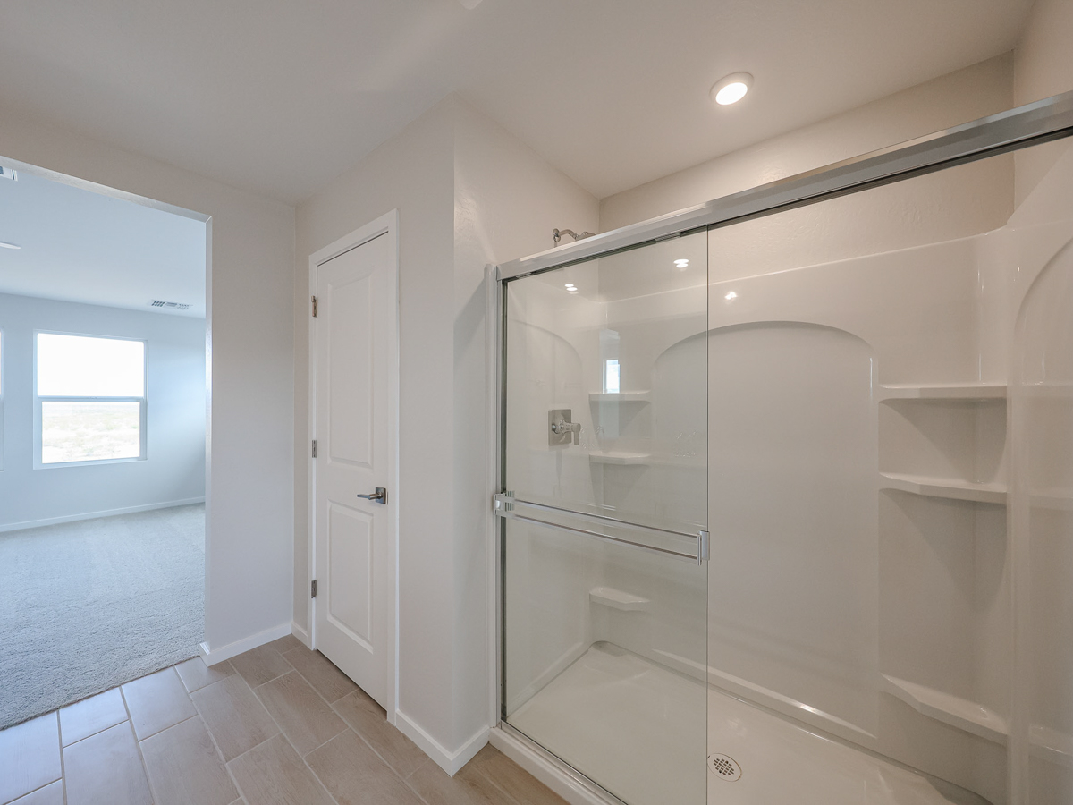 A bathroom with a glass shower.
