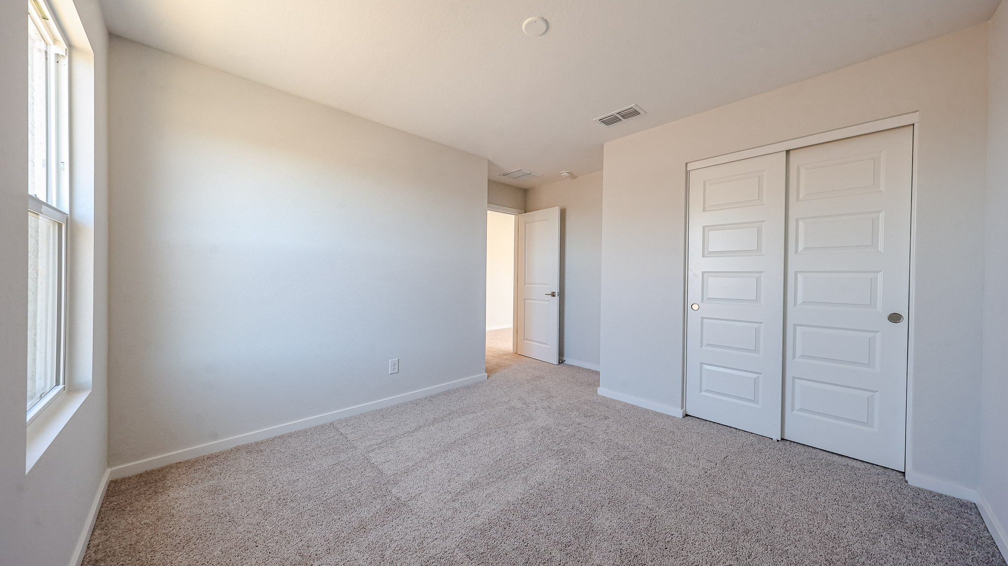 A room with white doors.