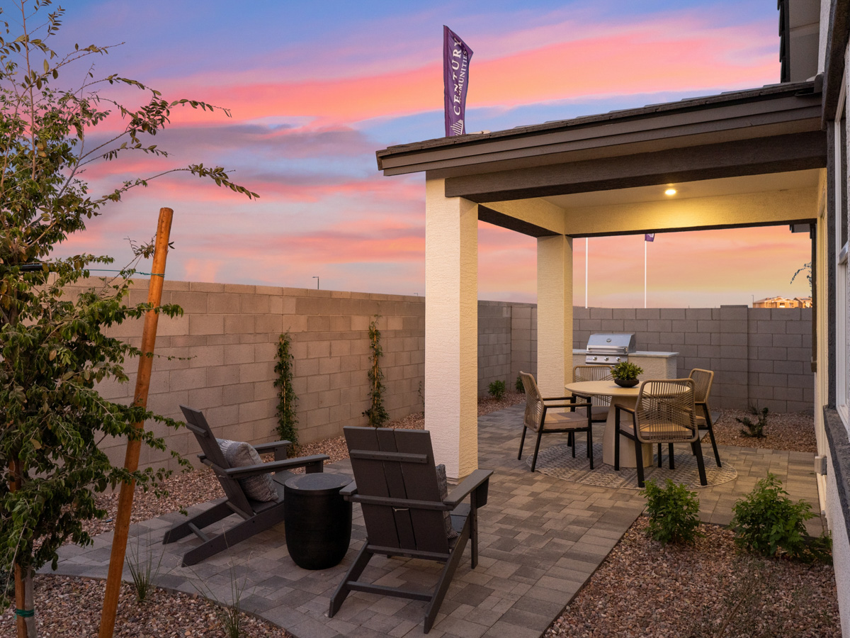 A patio with a table and chairs.