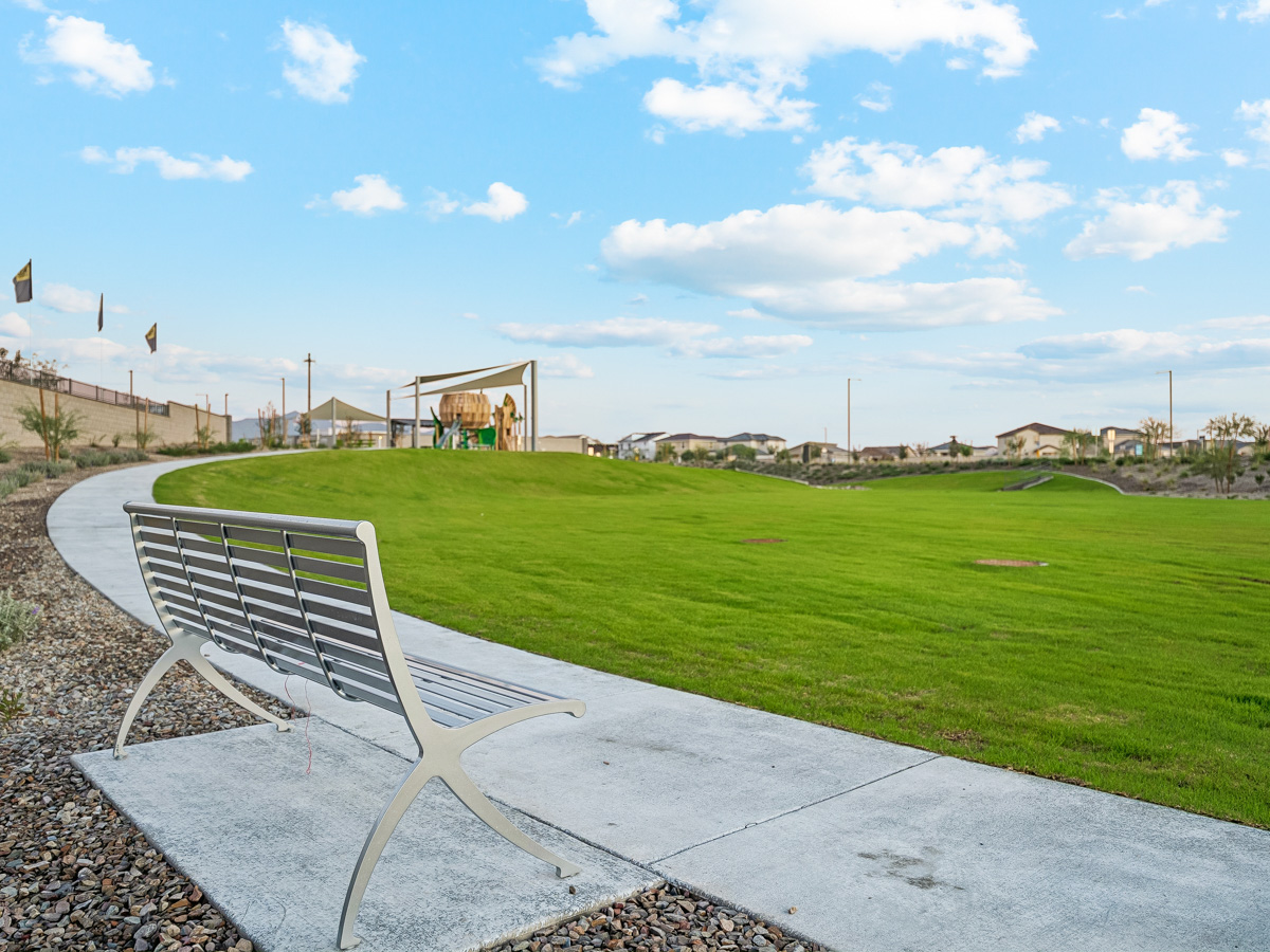 A bench on a grass field.