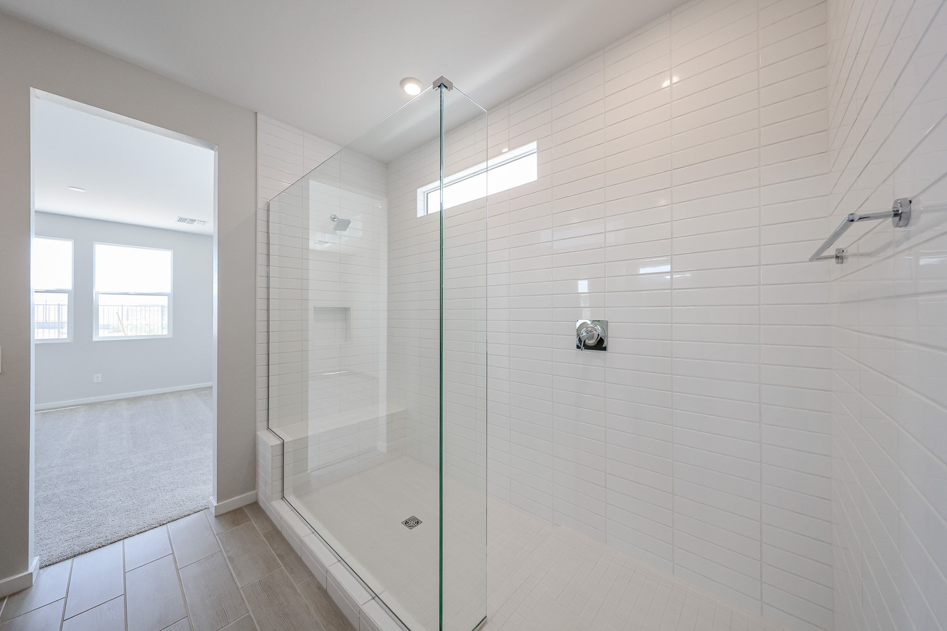 A bathroom with a glass shower.