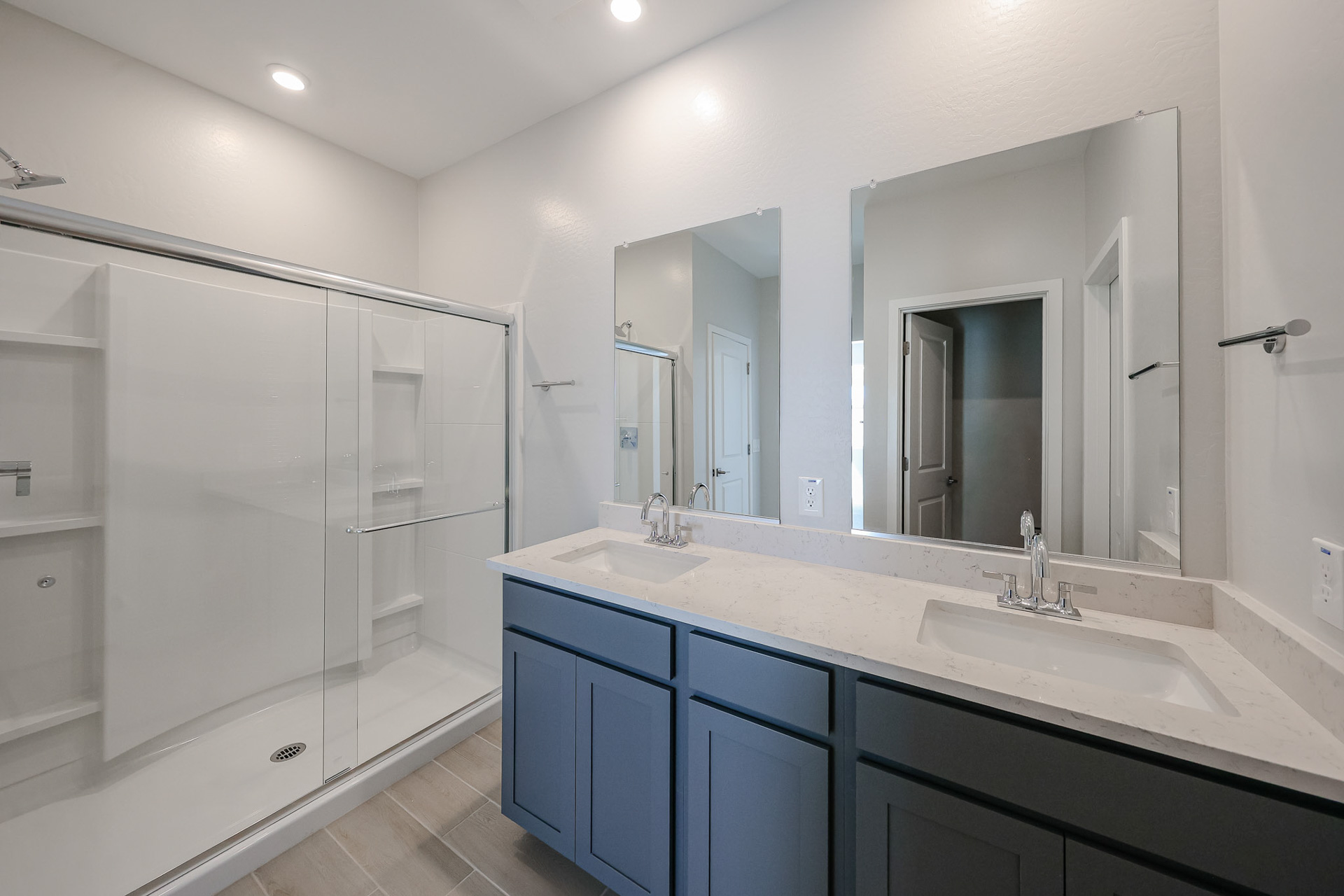 A bathroom with a large mirror.