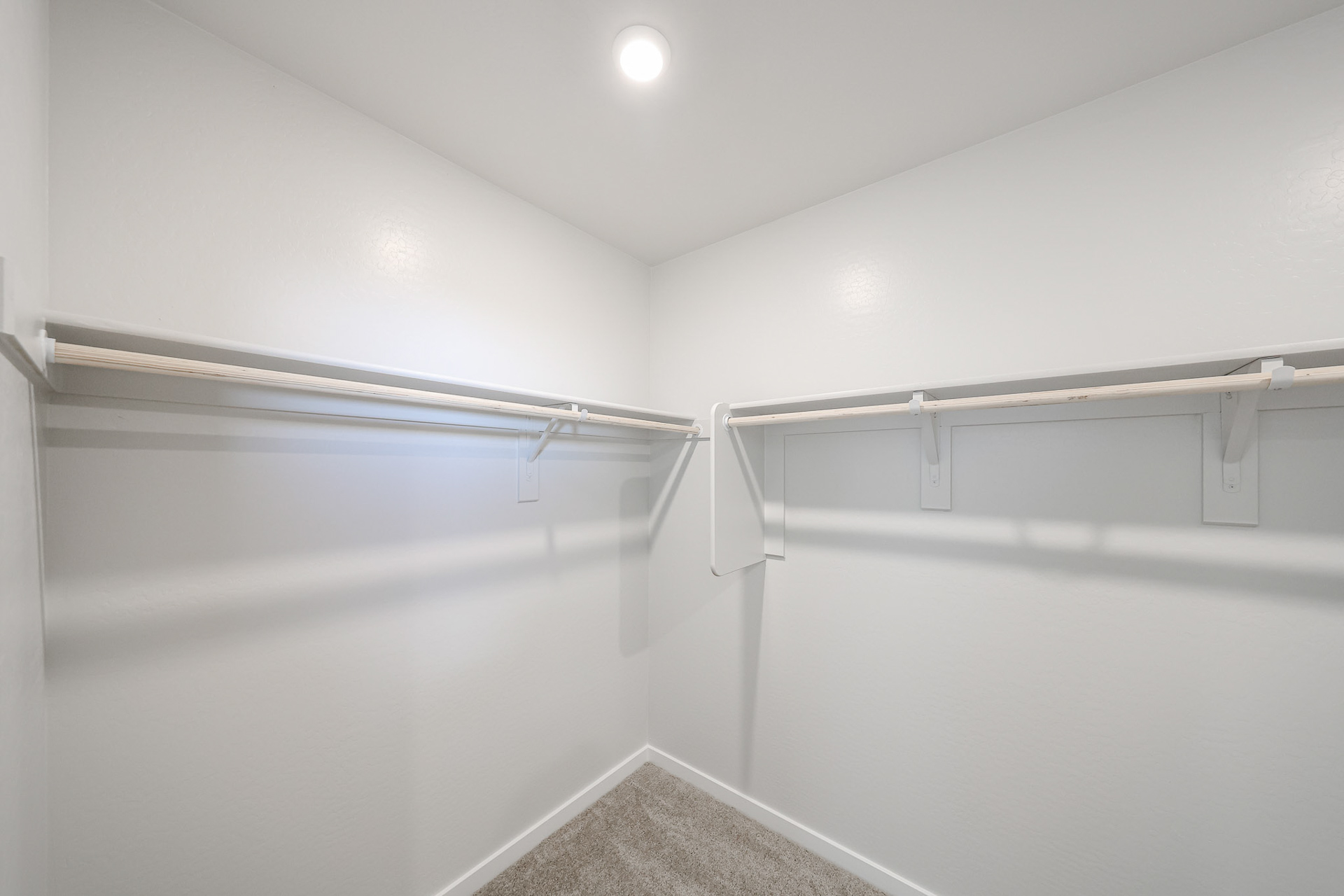 A white hallway with a light.
