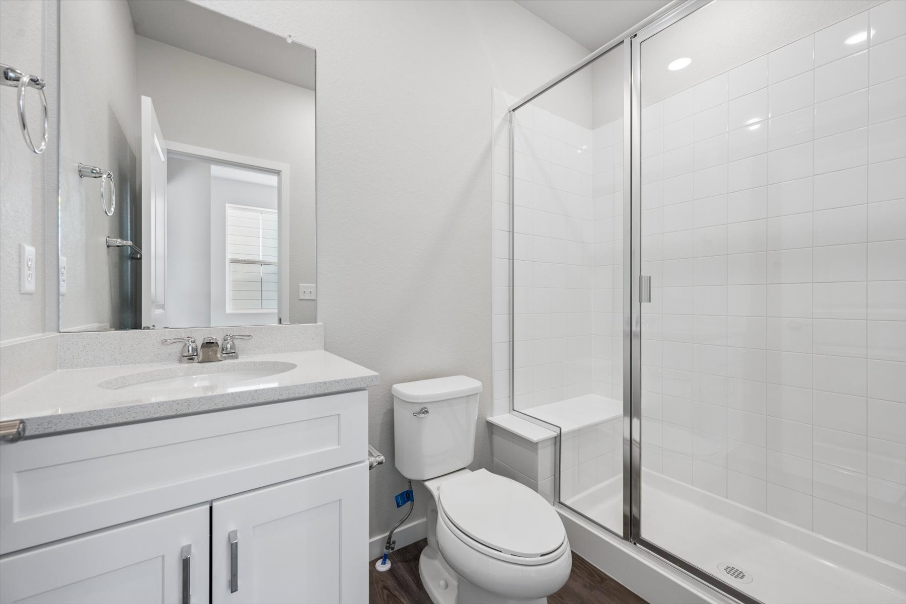 A bathroom with a glass shower.
