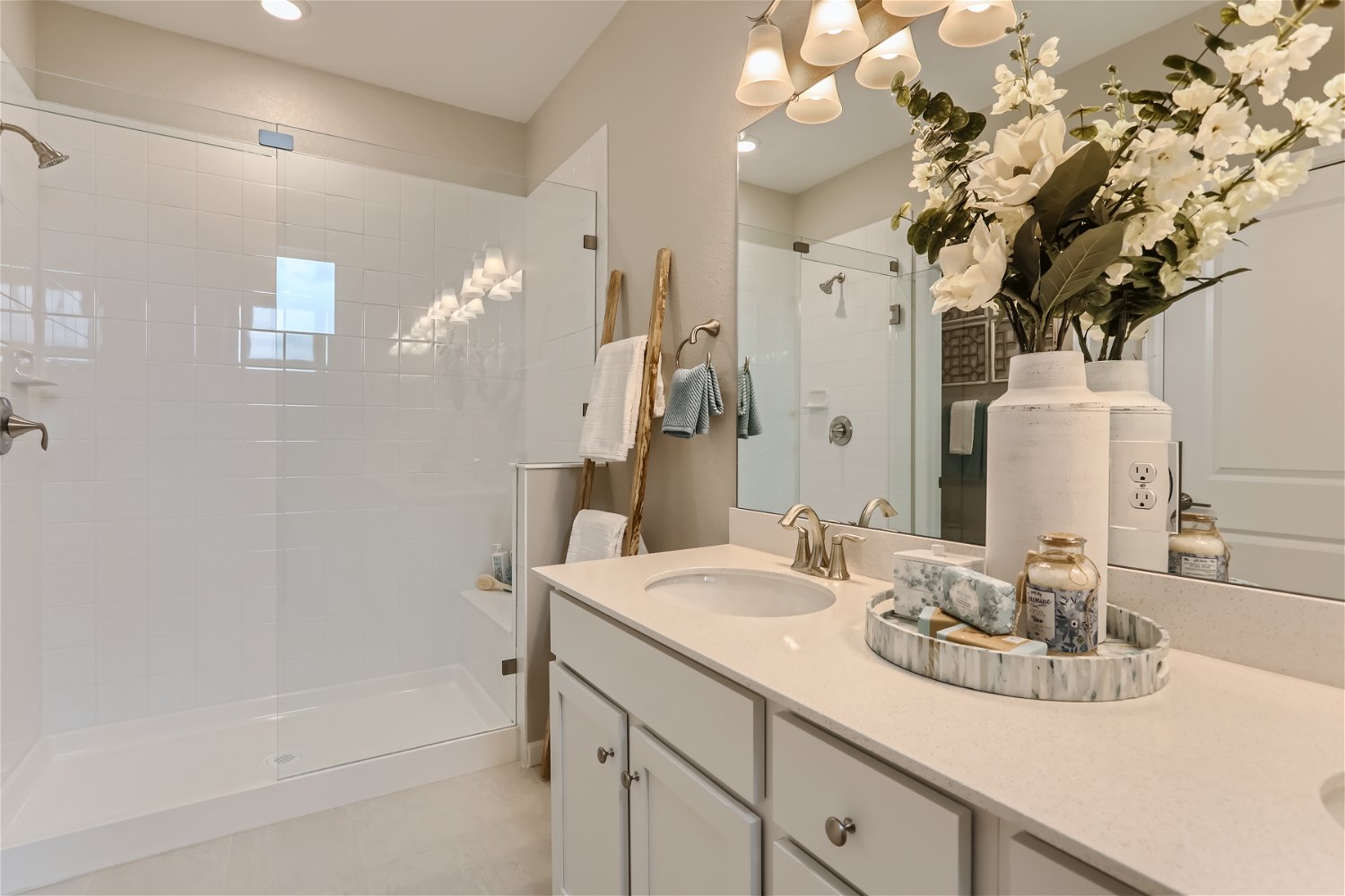 A bathroom with a large mirror.