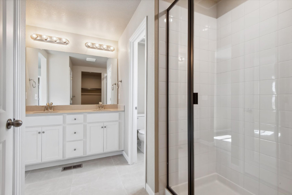 A bathroom with a glass shower.