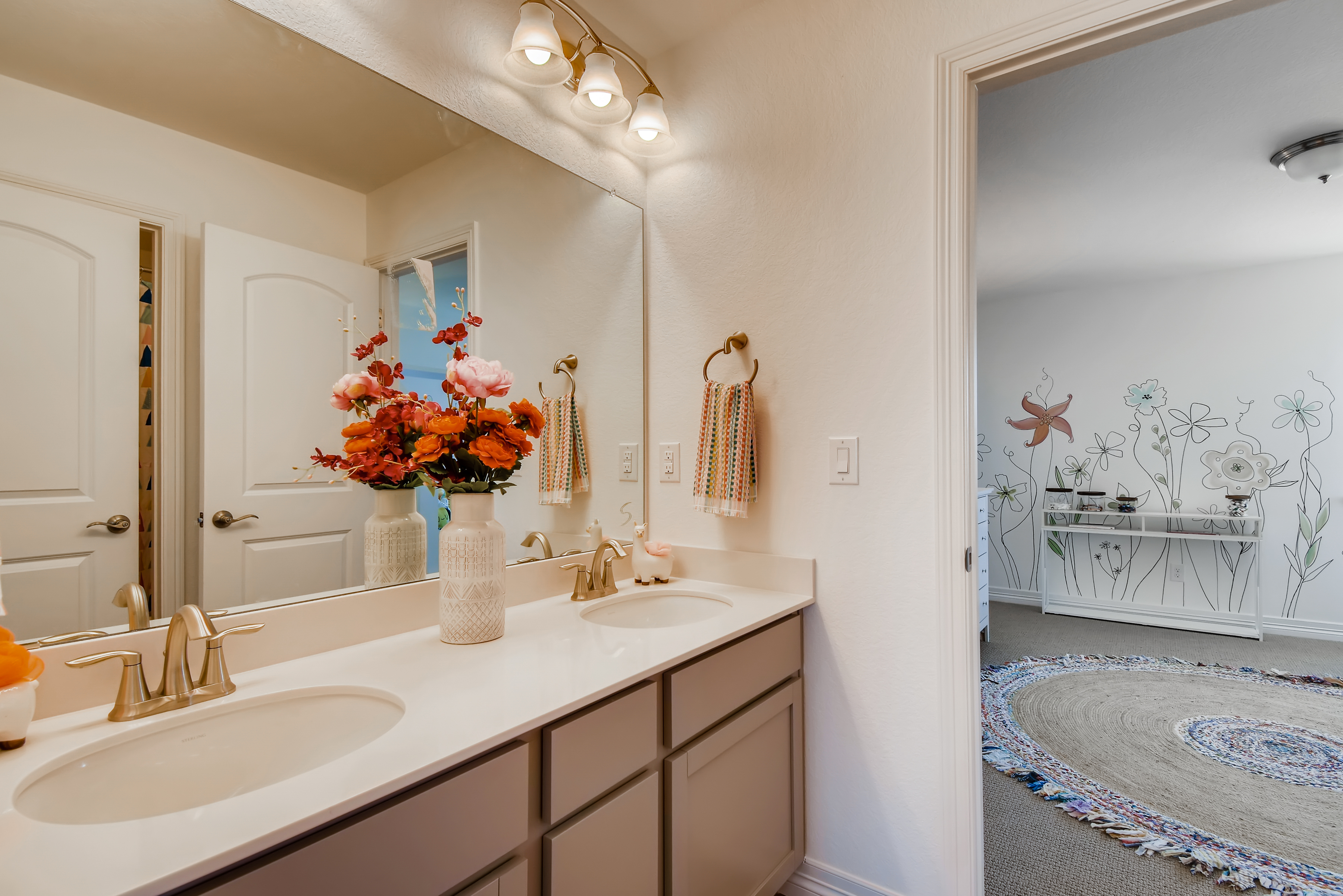 A bathroom with a large mirror.