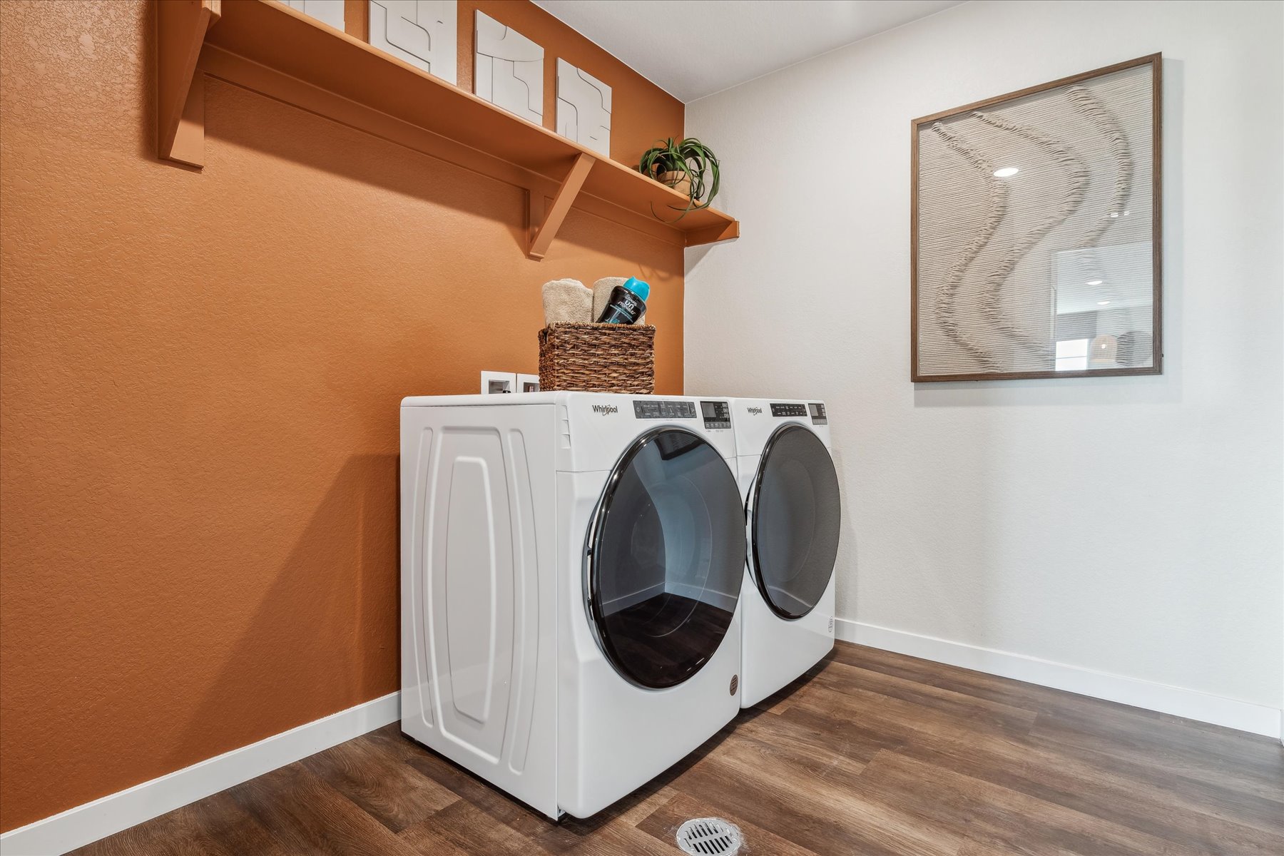 A laundry room with a washer and dryer.