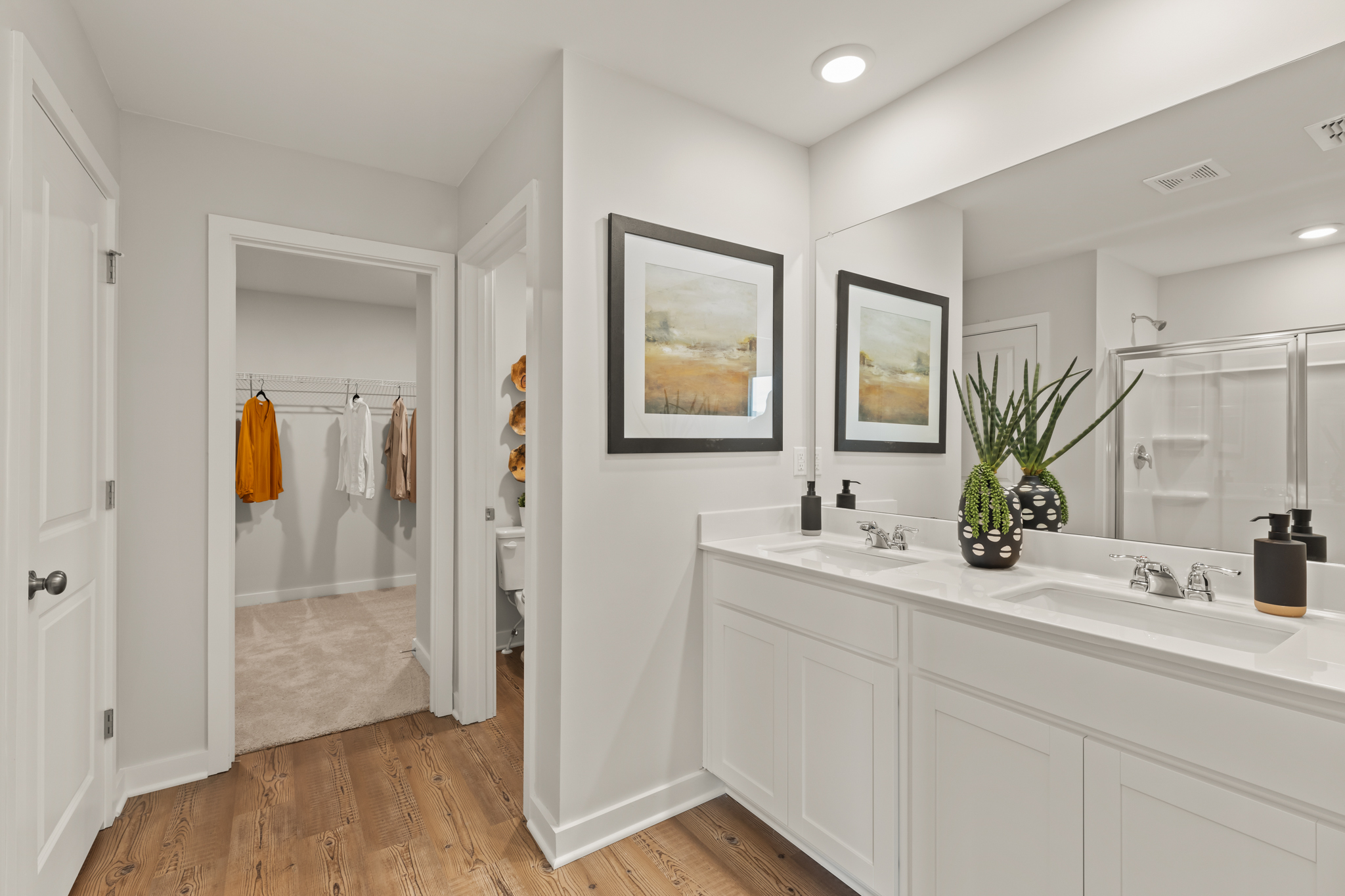 A bathroom with a large mirror.