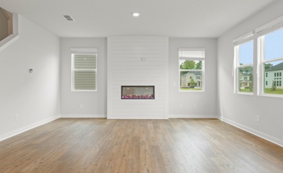 A room with white walls and windows.