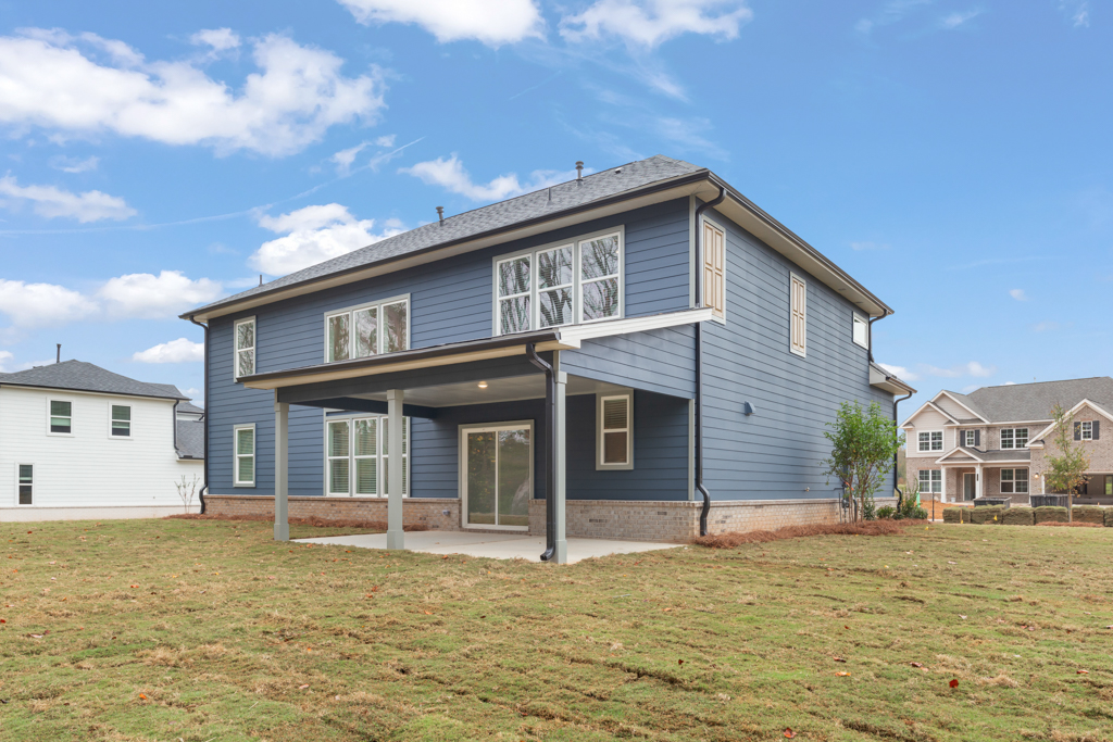 A house with a grass yard.