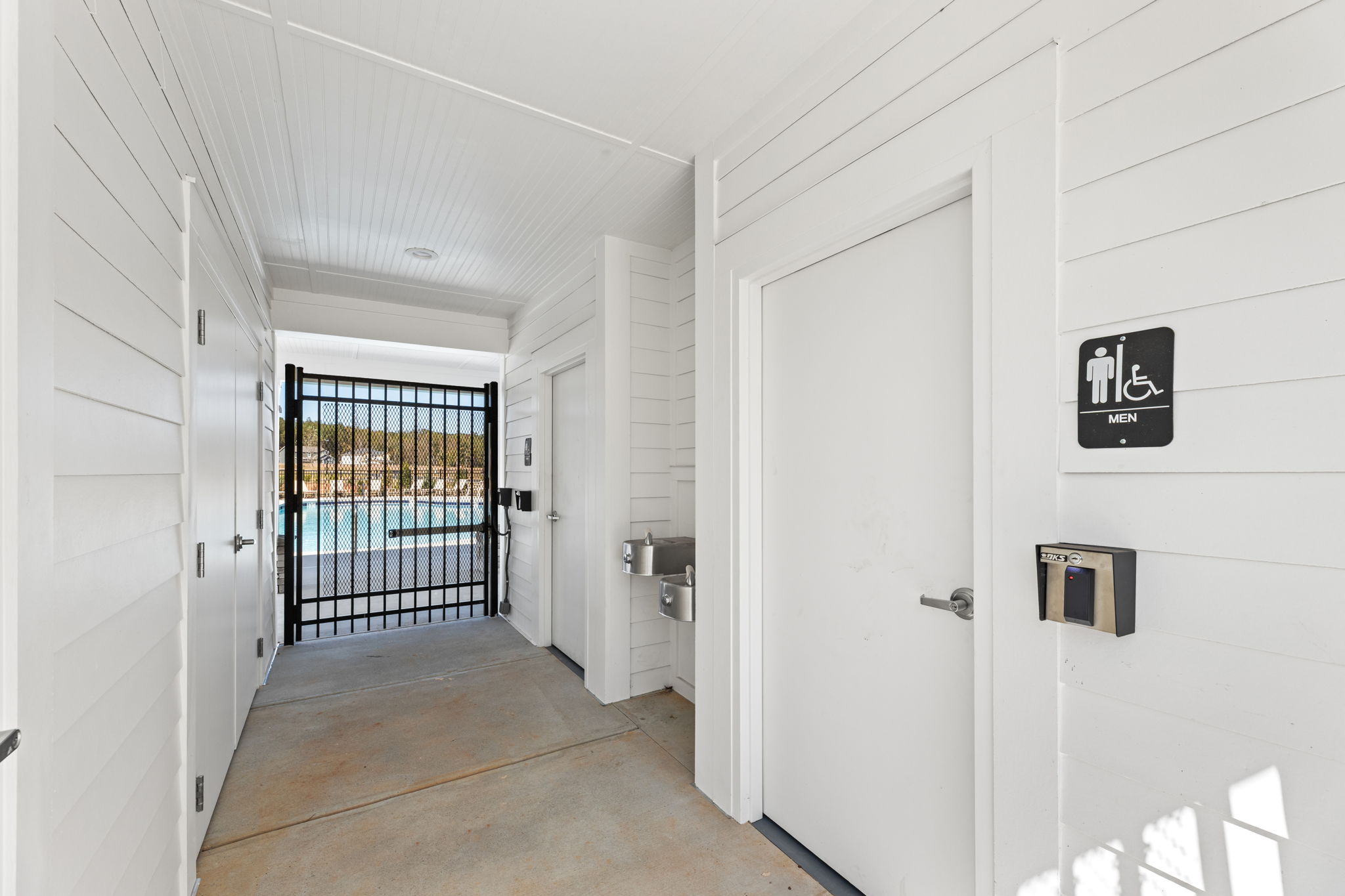 A hallway with white doors.