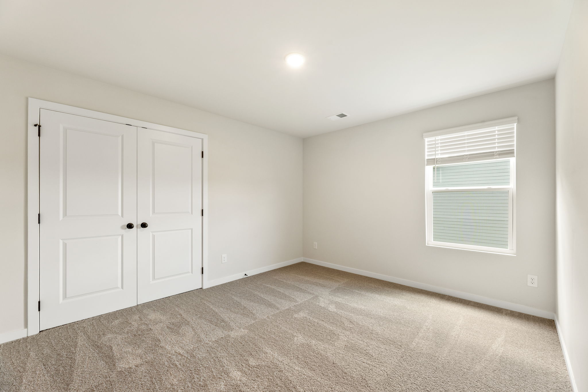 A room with white doors.