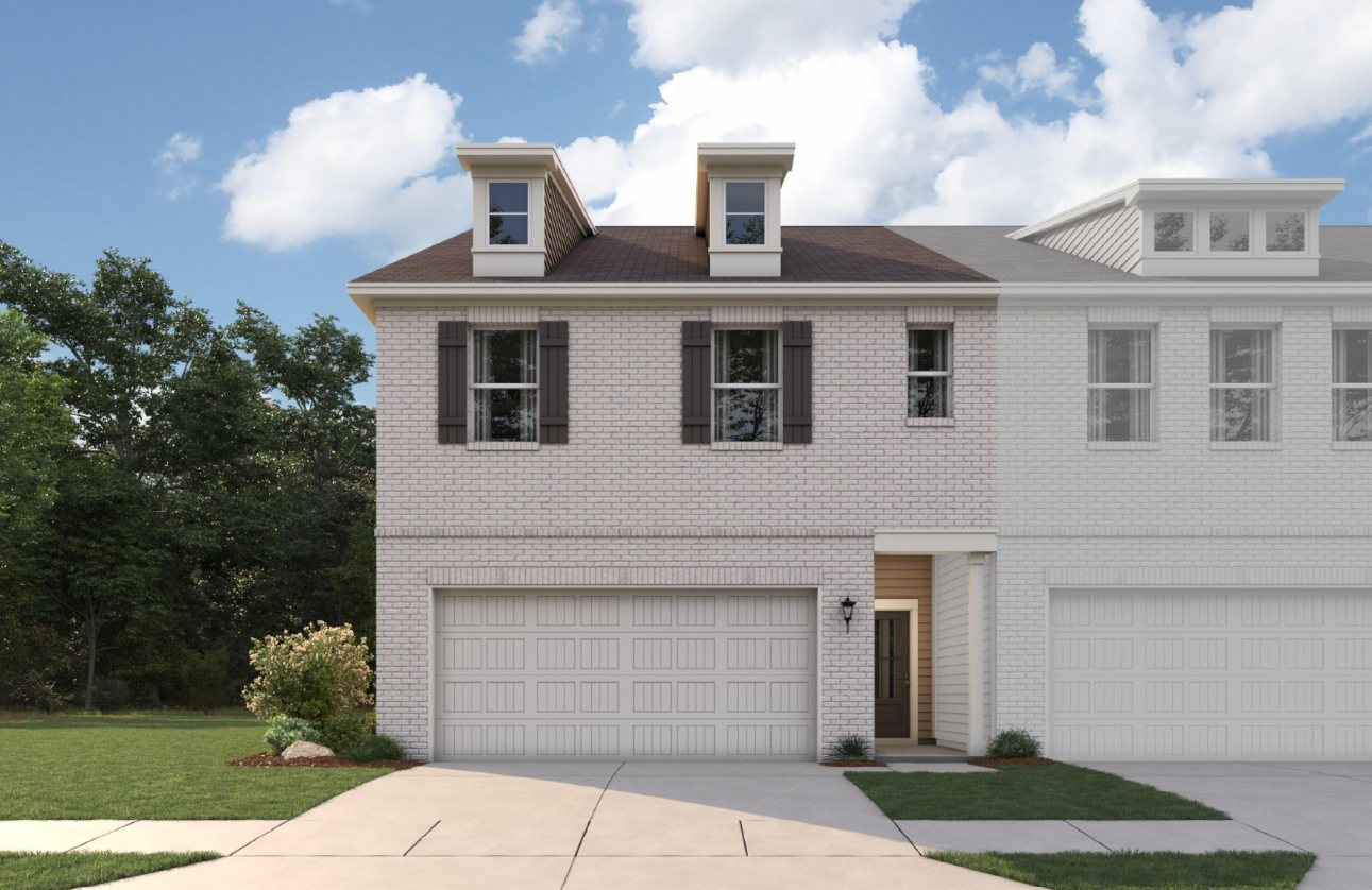 A white house with a driveway.