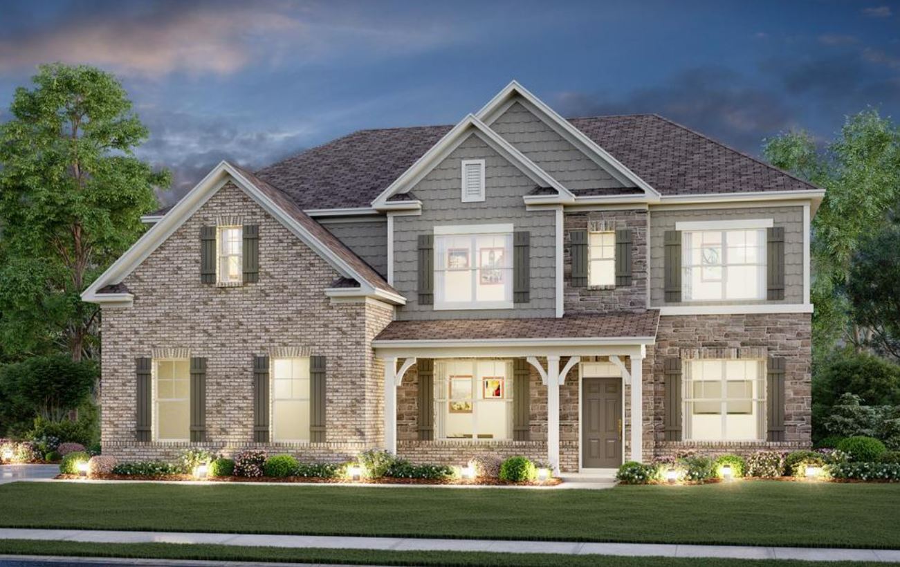 A large house with a lawn.