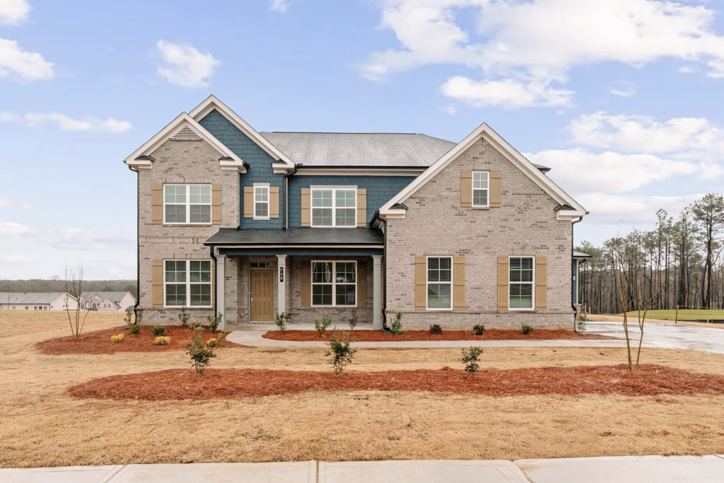 A house with a dirt yard.