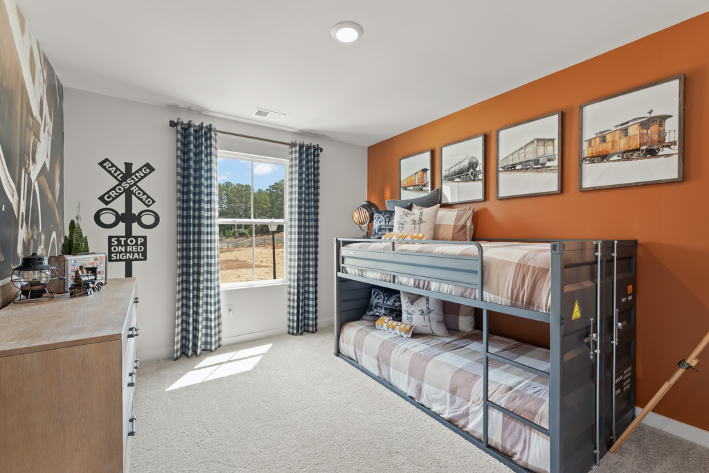 A bedroom with a bed and a window.