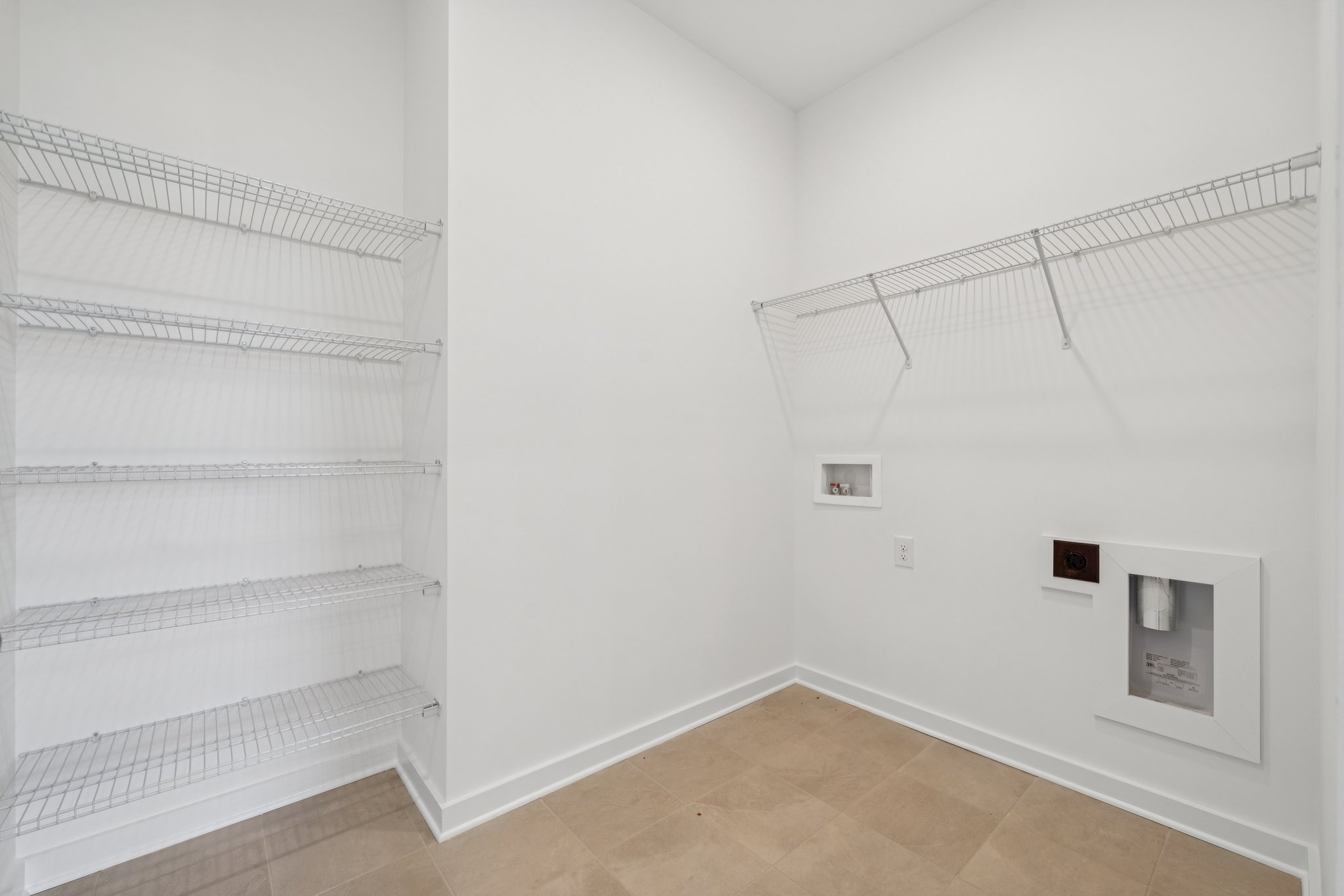 A white room with a white wall.