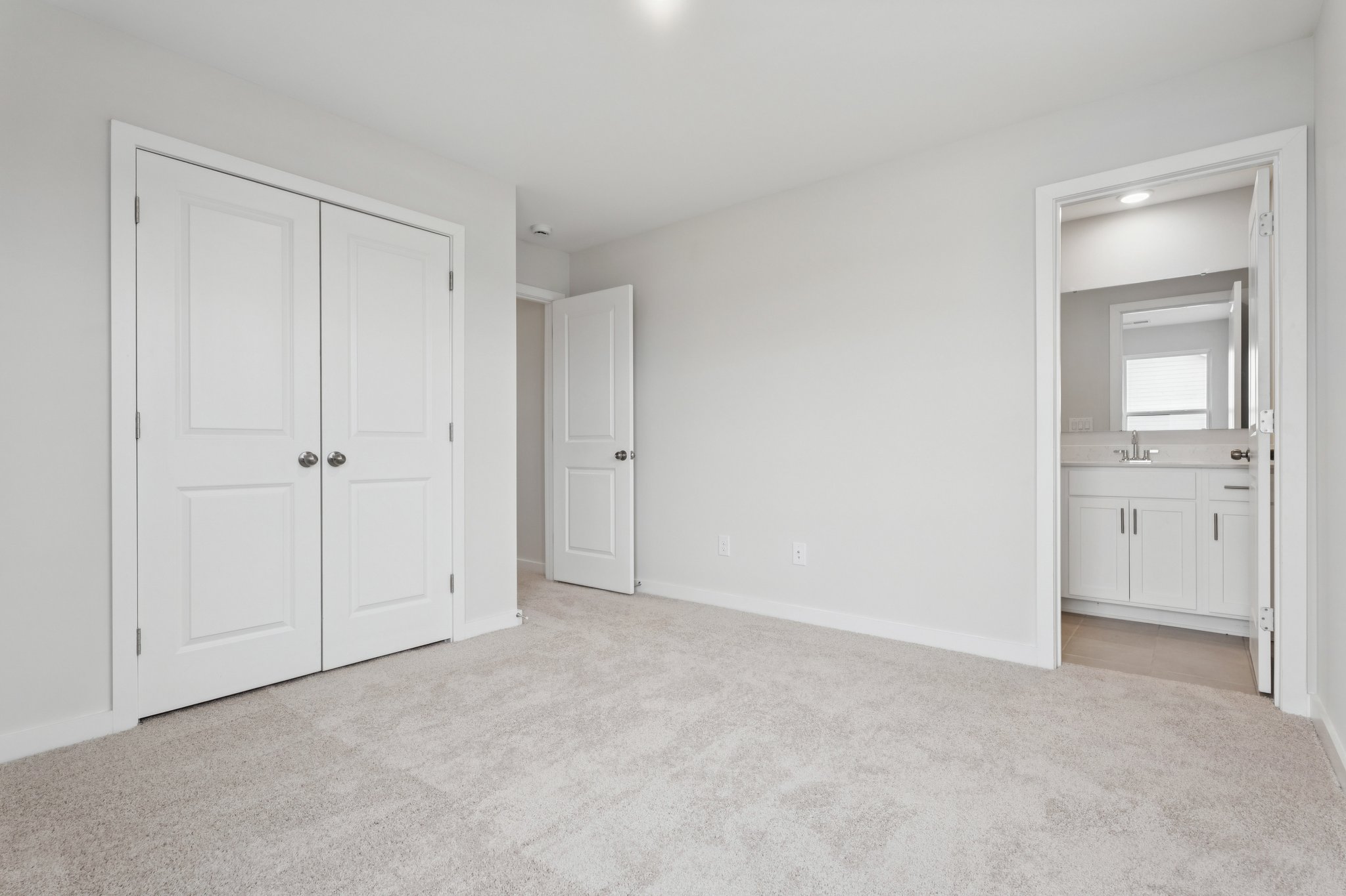 A room with white doors.