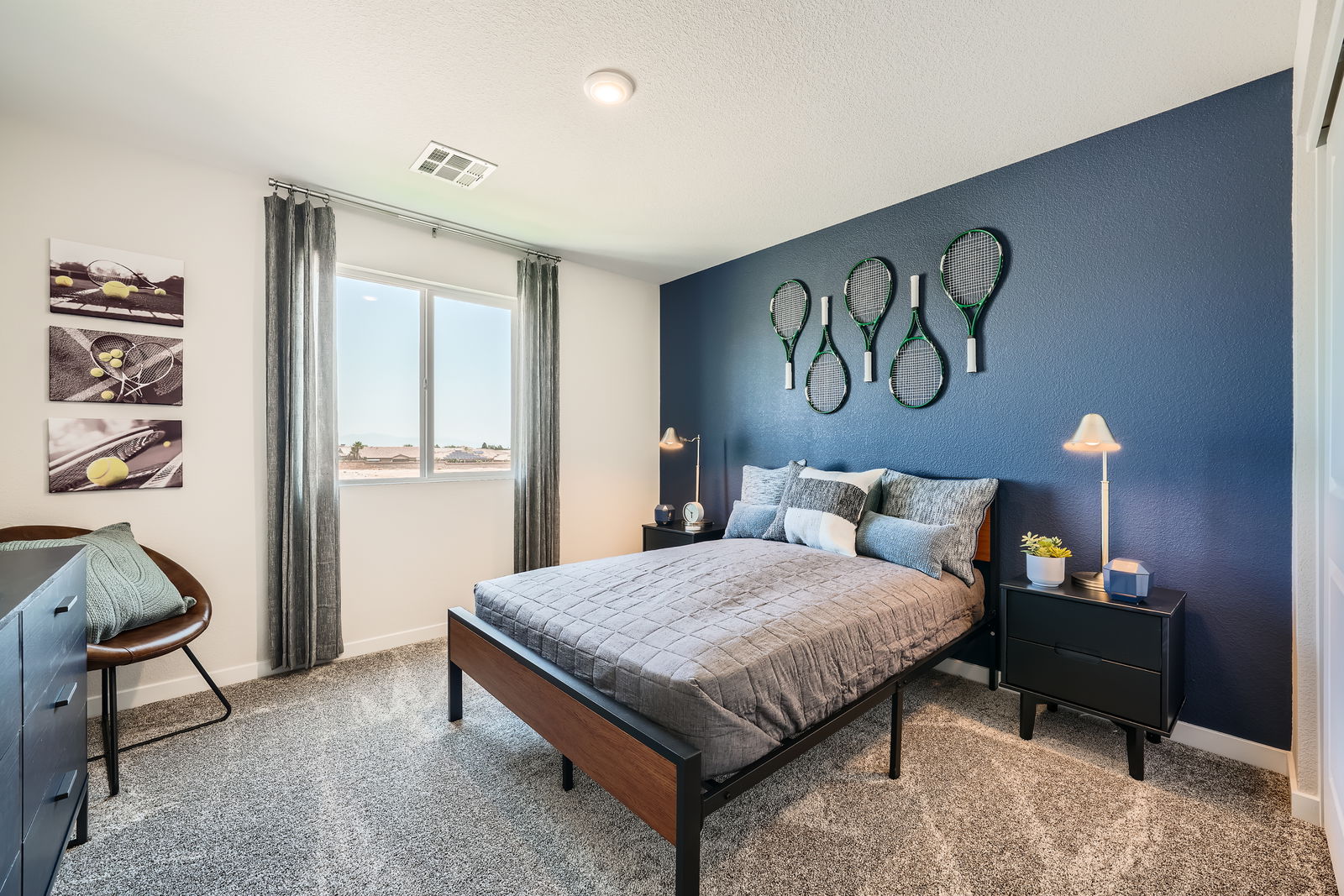 A bedroom with a bed and a bench.