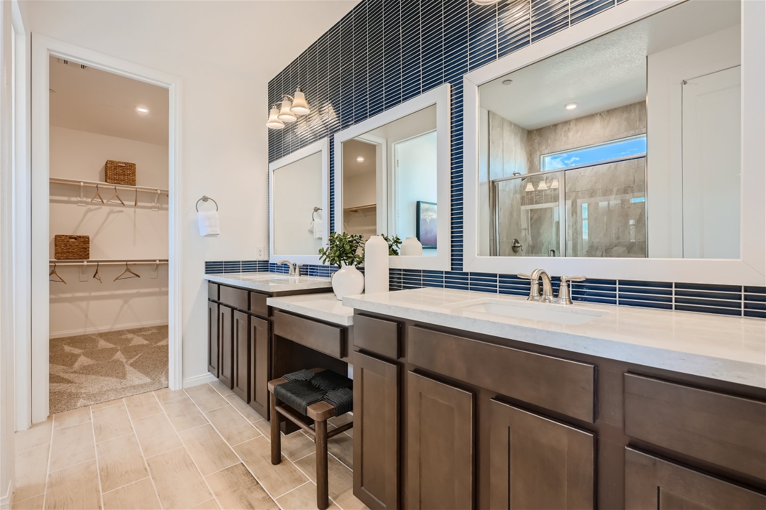 A bathroom with a large mirror.