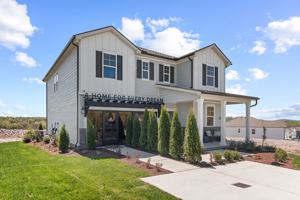 A white building with a sign on it.