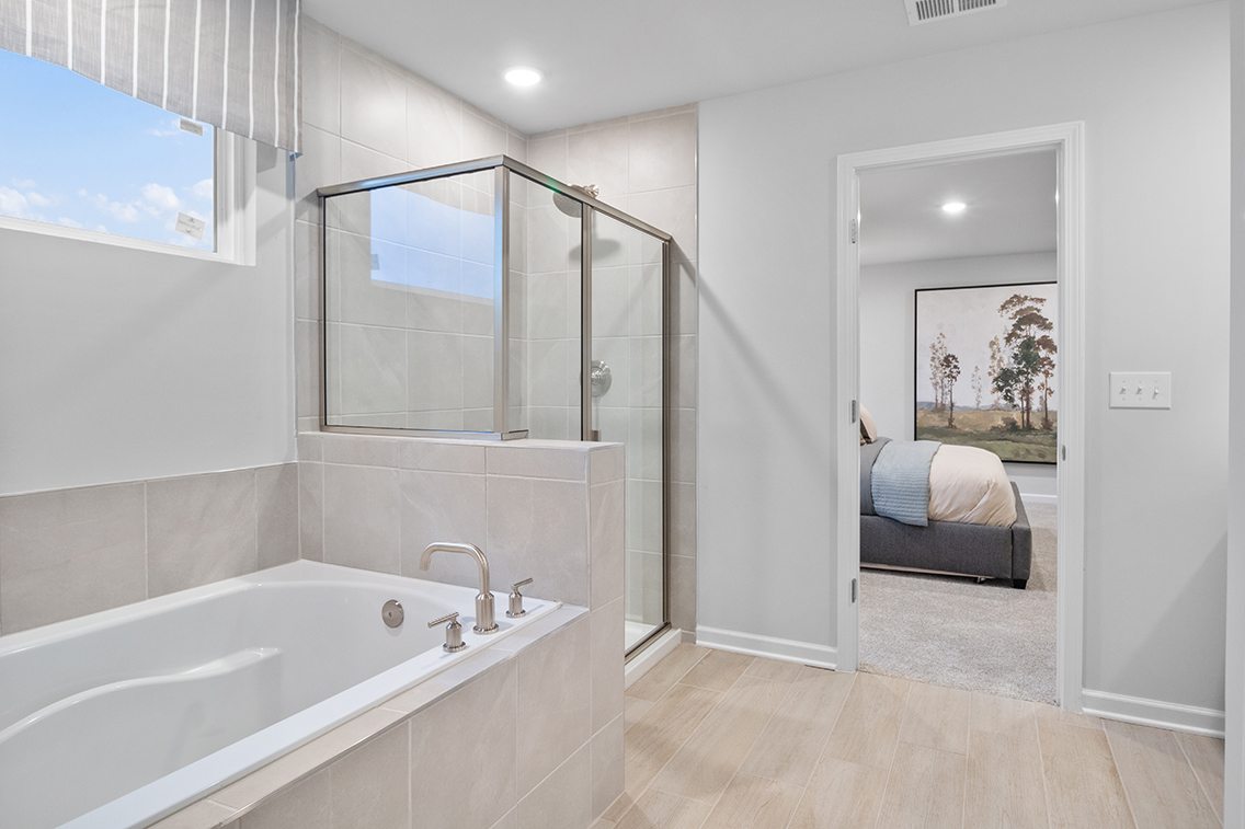 A bathroom with a tub and a sink.