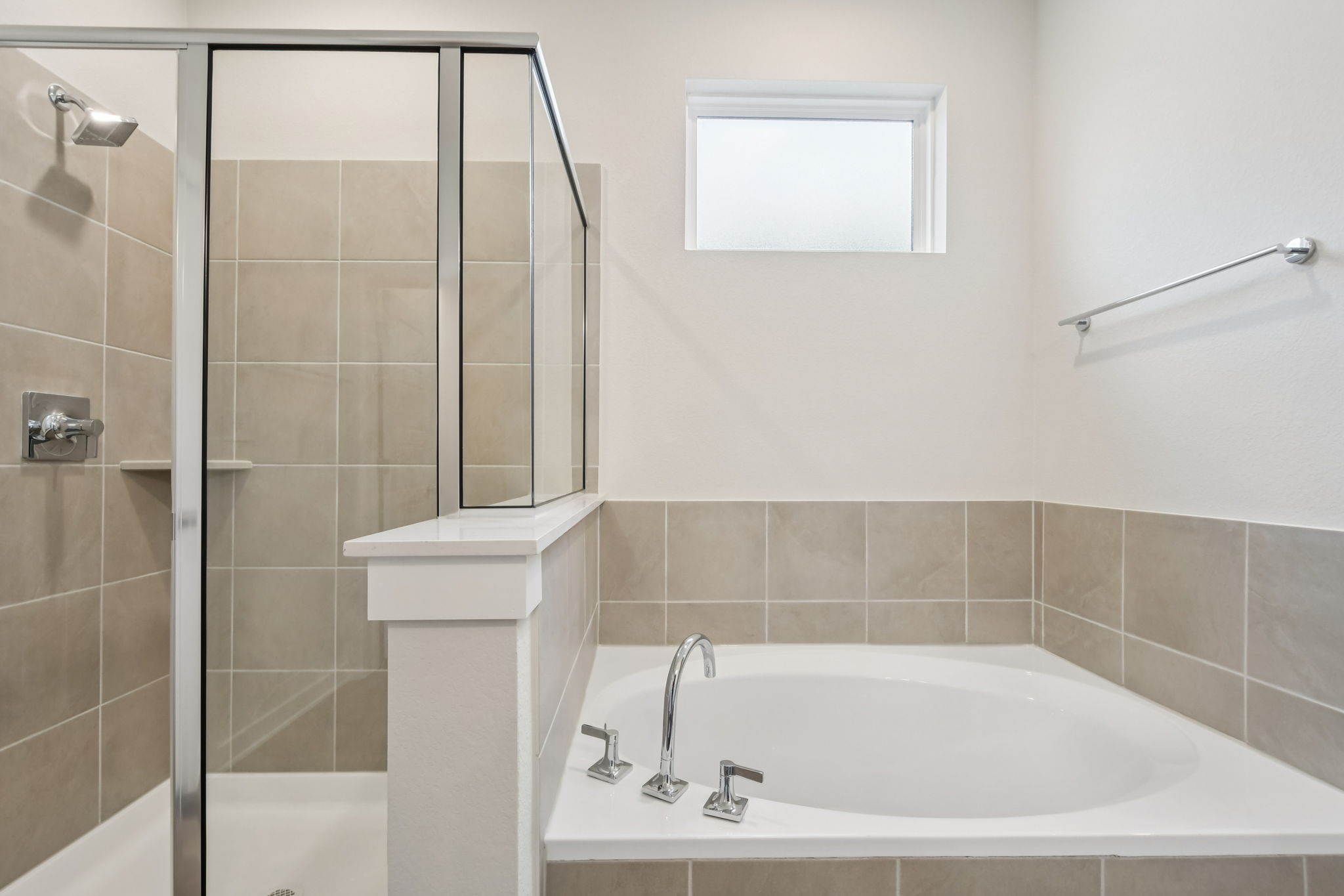 A bathroom with a glass shower.