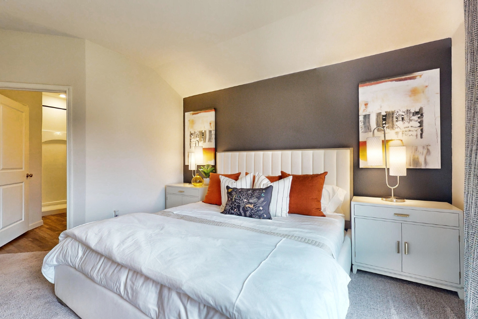 A bedroom with a large bed.