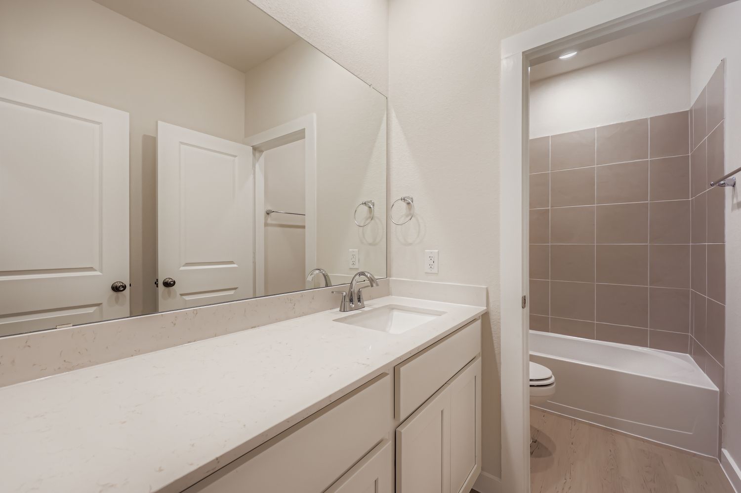 A bathroom with a sink and a bathtub.
