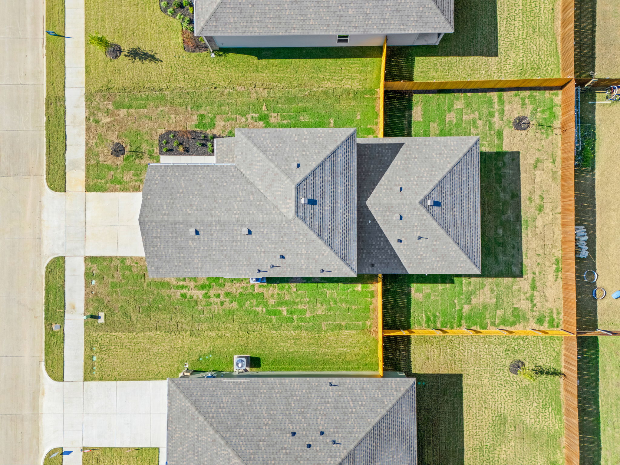 A building with a grass field.