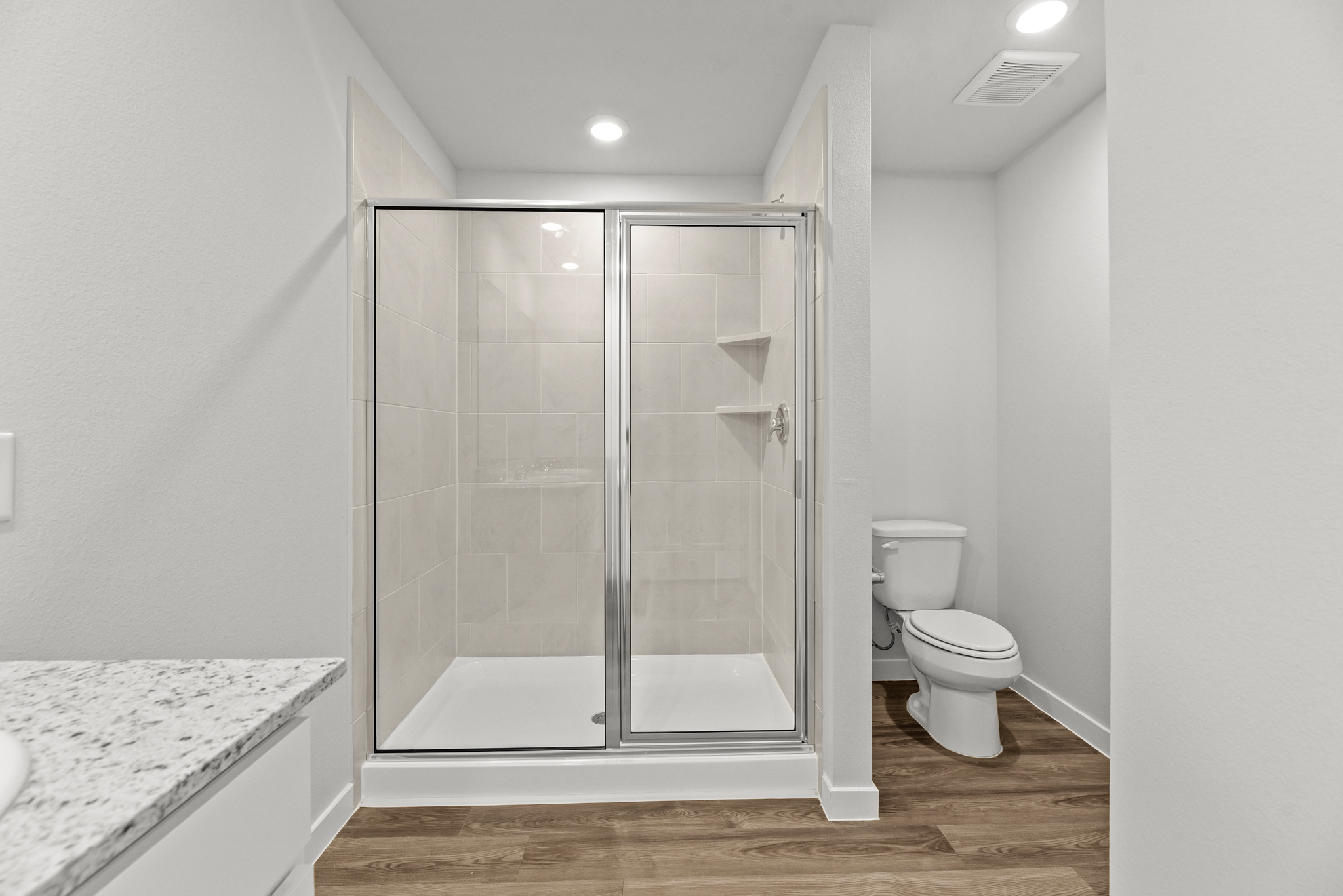A bathroom with a glass shower.
