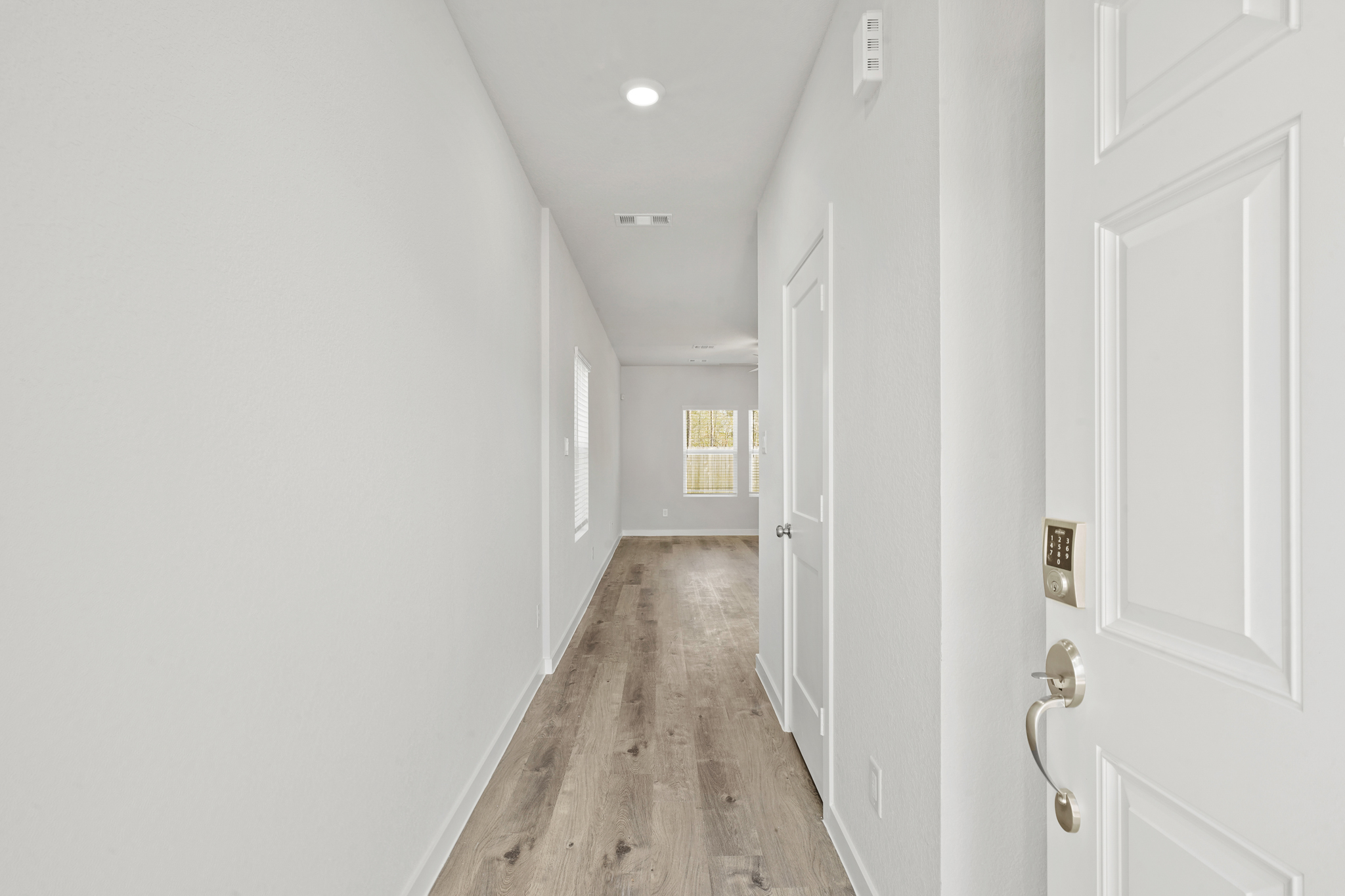 A hallway with white doors.