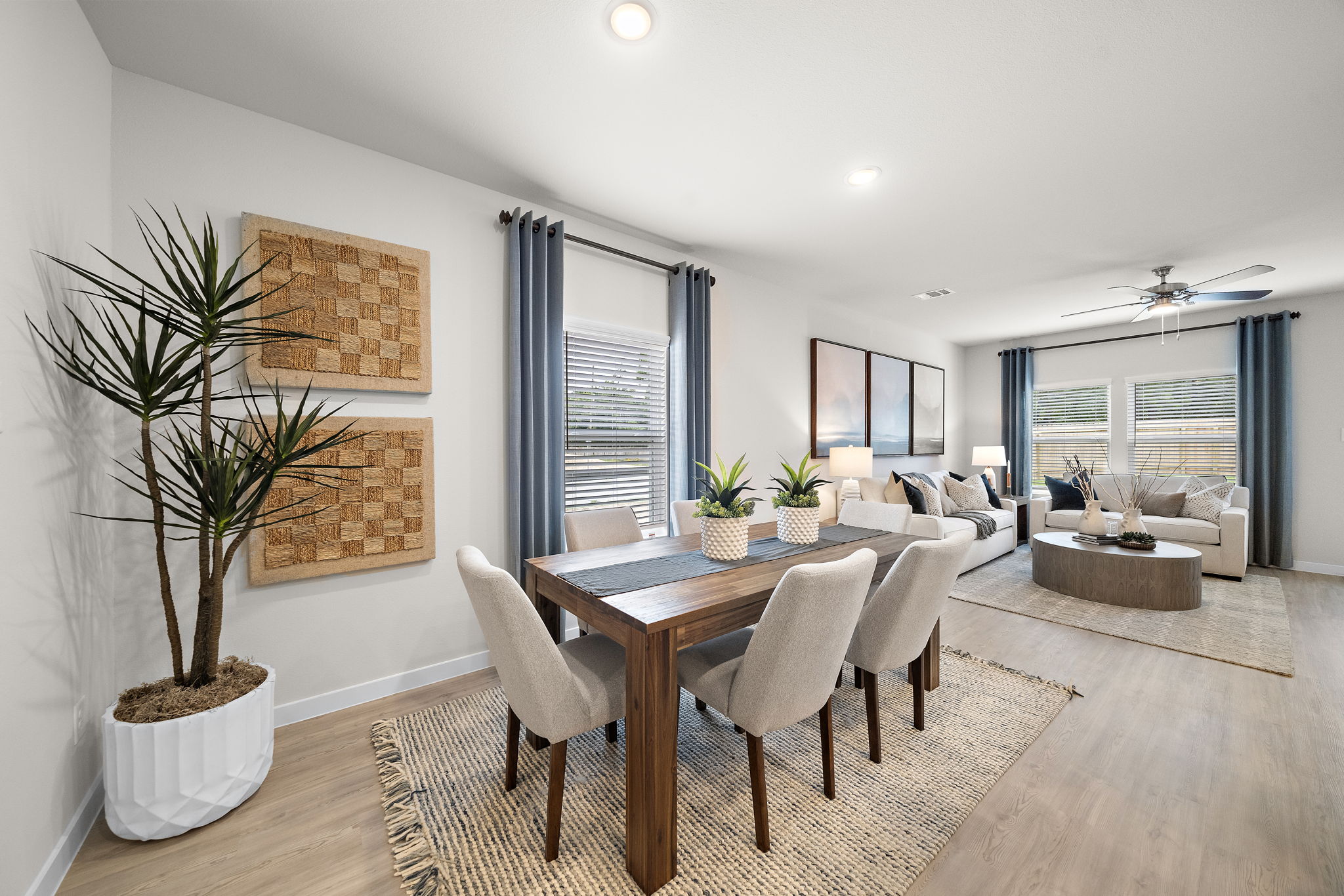 A dining room with a large table.