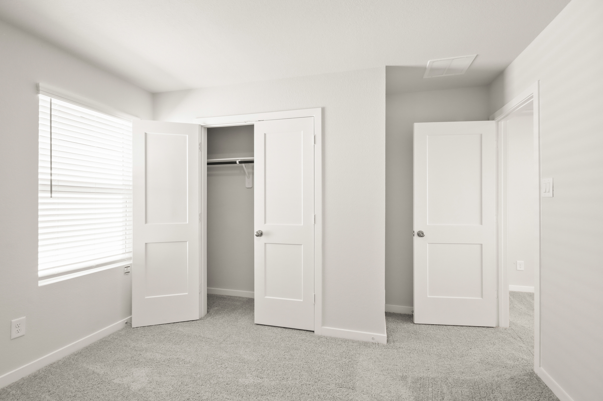 A room with white doors.