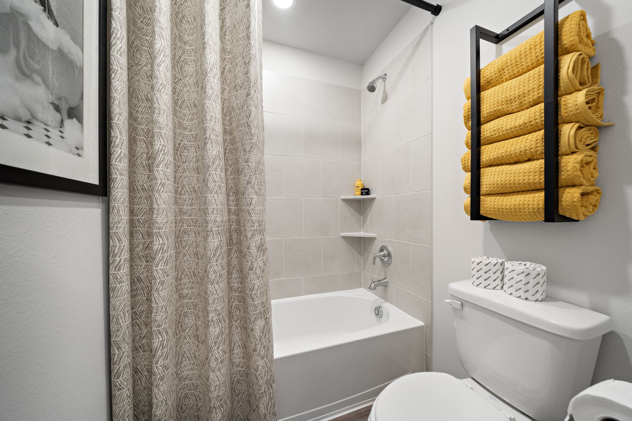 A bathroom with a shower curtain.