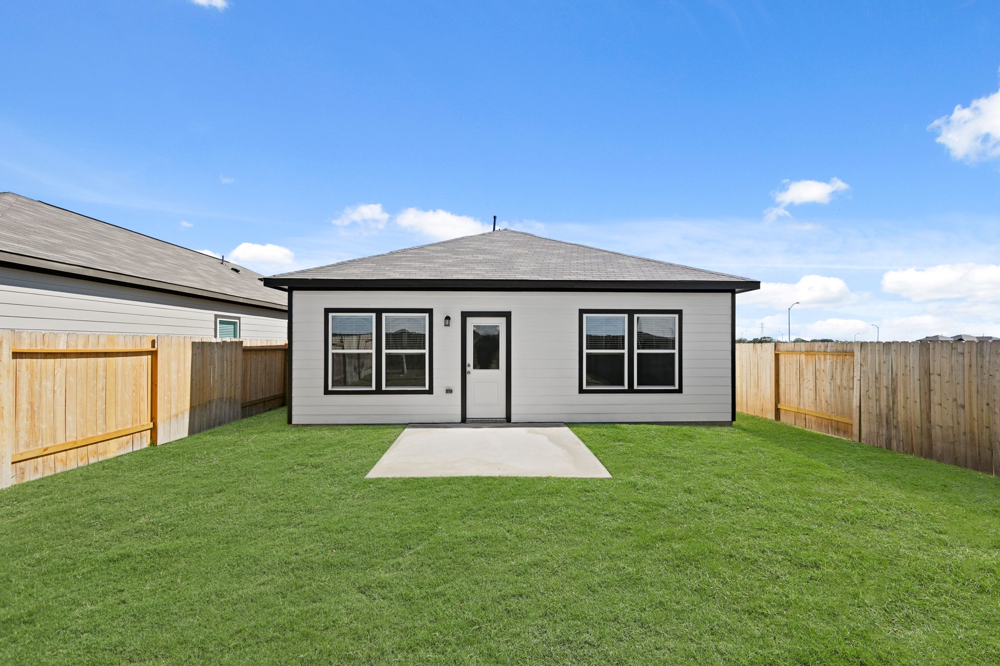 A house with a fence around it.