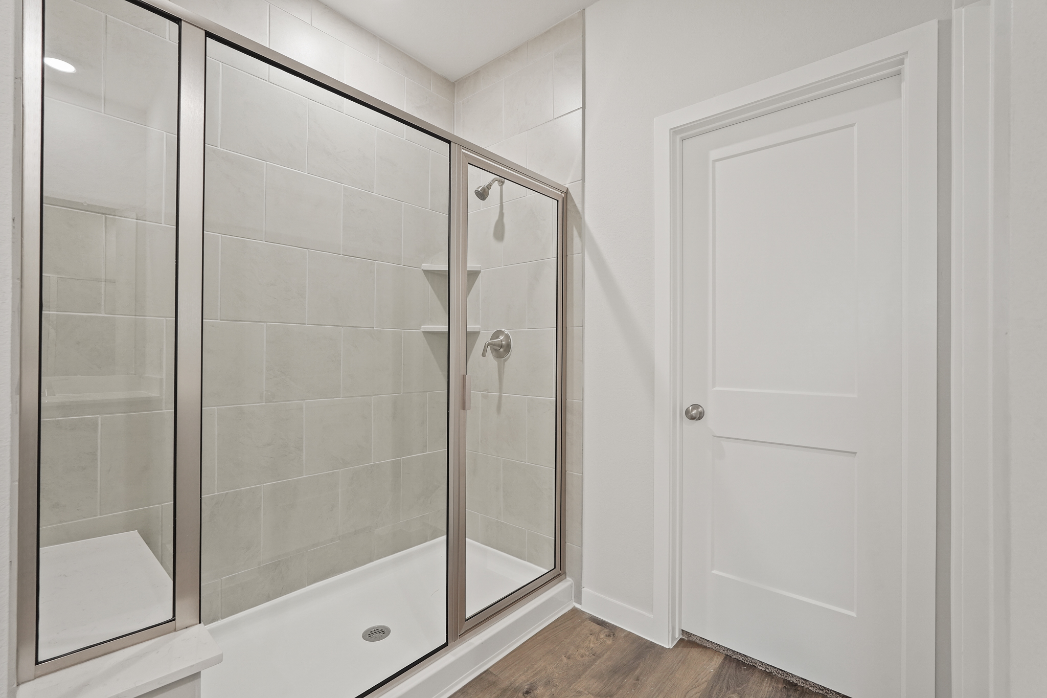 A bathroom with a glass shower.