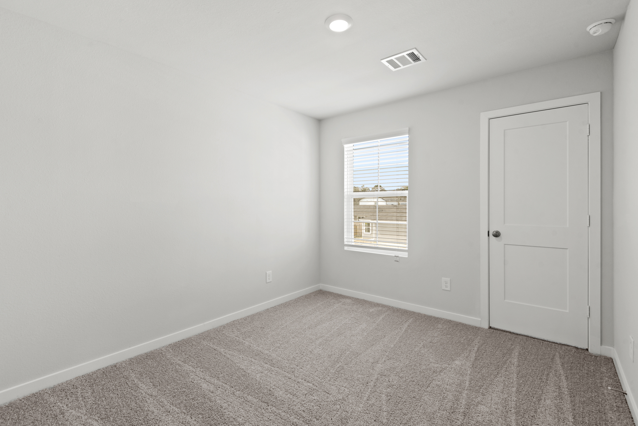 A room with a door and a window.