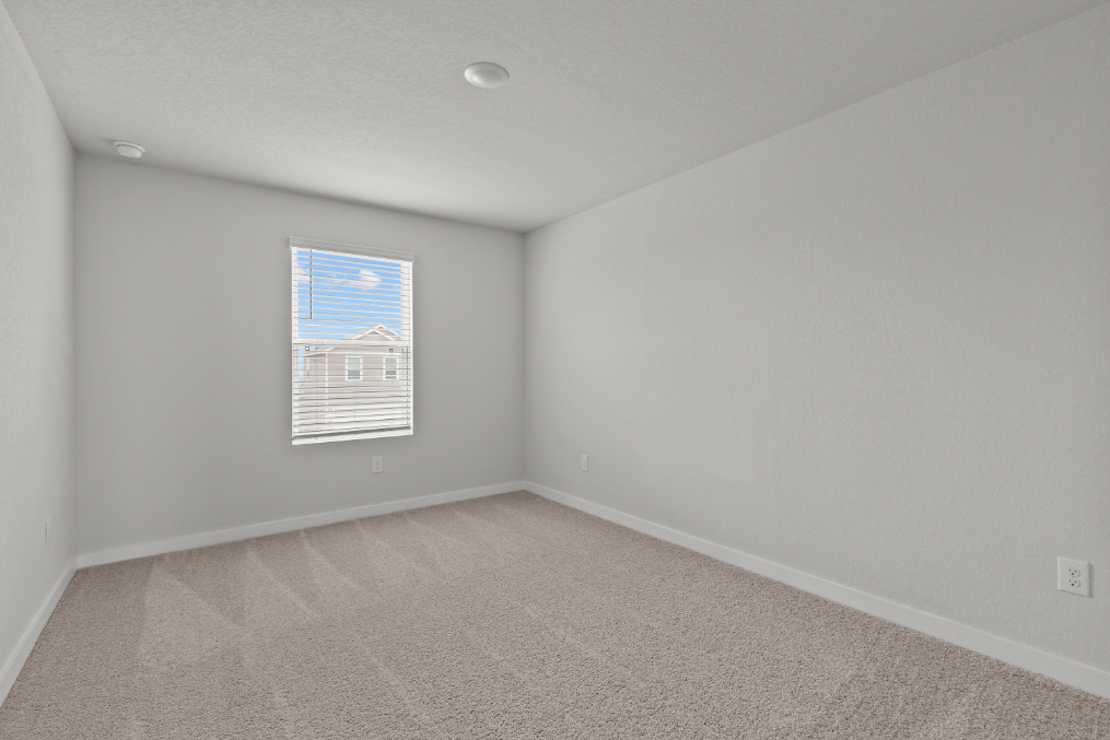 A room with a white wall and a blue and white striped wall.
