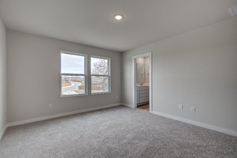 A room with a window and a door.