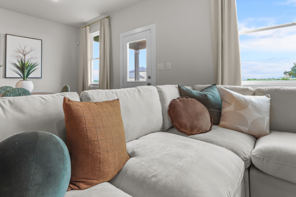 A couch with pillows.